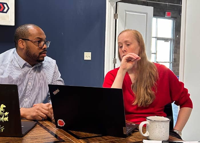 Operations Manager Collaborating with Director of Technology